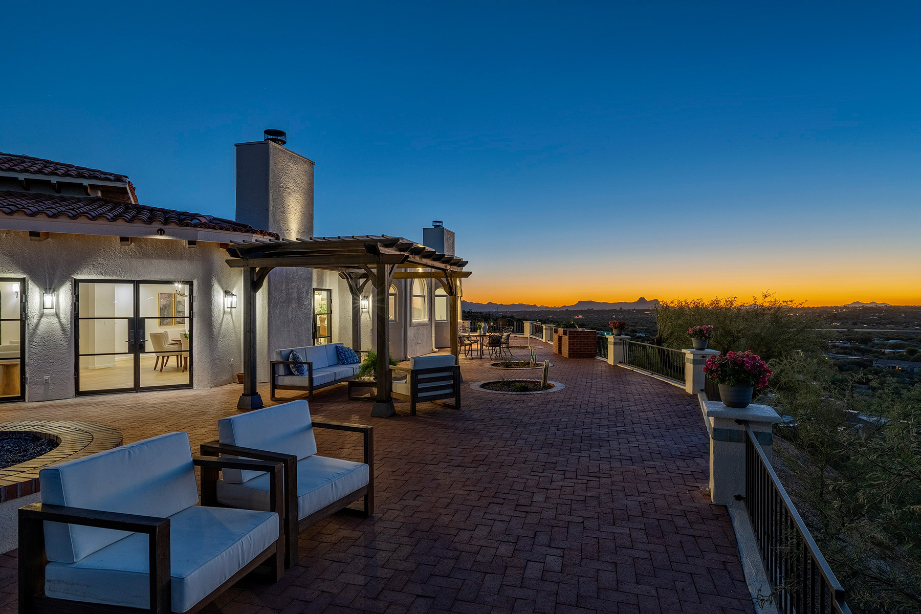 Renovated Oro Valley home at sunset showcasing outdoor living spaces, custom architecture, and panoramic desert views