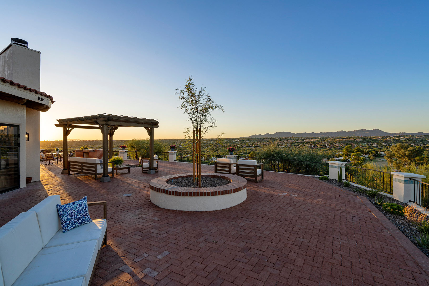 Expansive outdoor living area overlooking Oro Valley with custom patio design, mountain views, and seamless indoor-outdoor living