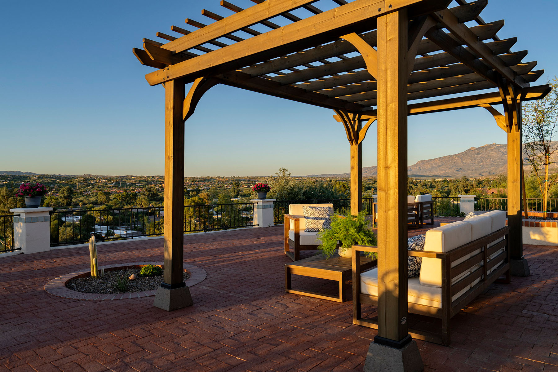 Custom pergola and outdoor living area designed for entertaining while capturing sweeping mountain and valley views in Oro Valley